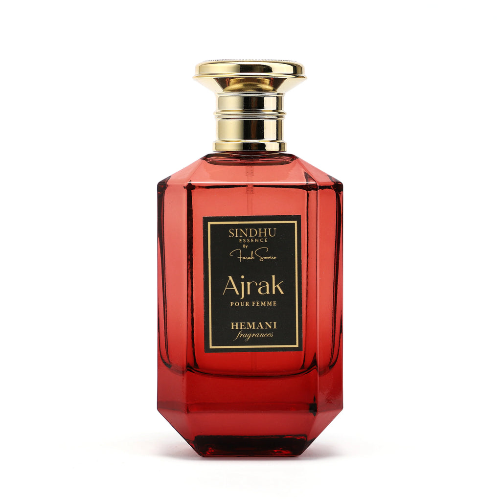 Ajrak Pour Femme by Hemani Fragrances, a luxurious red perfume bottle with gold accents