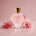 Floraison Pour Femme perfume bottle with pink flowers, elegant fragrance for women